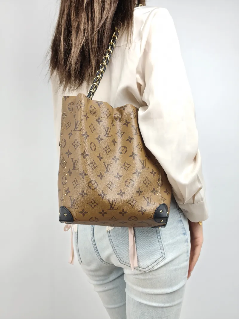 Louis Vuitton Shoulder Bag NOÉ TRUNK Monogram PVC Small 23 × 8 × 27 cm — on-model view 1 of 2