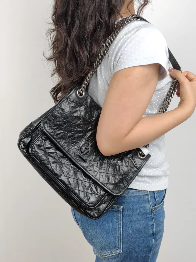 SAINT LAURENT Crossbody Bag Niki D Waxed Leather Calfskin Medium 28 × 8.5 × 20 cm — on-model view 2 of 2