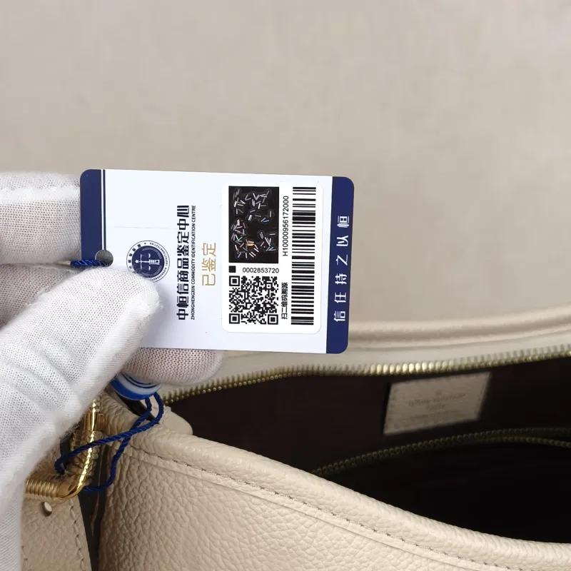 Louis Vuitton carryall Small White Calfskin Microchip Edition · Shoulder Strap Inner Pouch Leather Tag · 29.5 × 12 × 24 cm — detail view 10 of 11