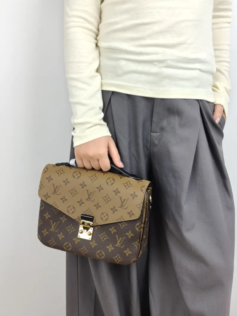 Louis Vuitton Crossbody Bag Pochette Métis Monogram Colorblock PVC Medium 25 × 7 × 19 cm — on-model view 3 of 3
