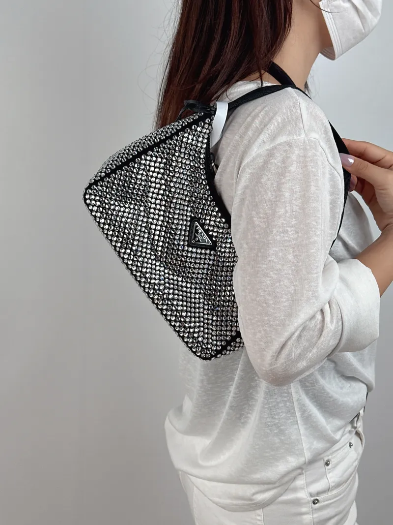 PRADA Shoulder Bag Re-Edition 2000 Hobo Black Mini 22 × 6 × 17 cm — on-model view 1 of 2