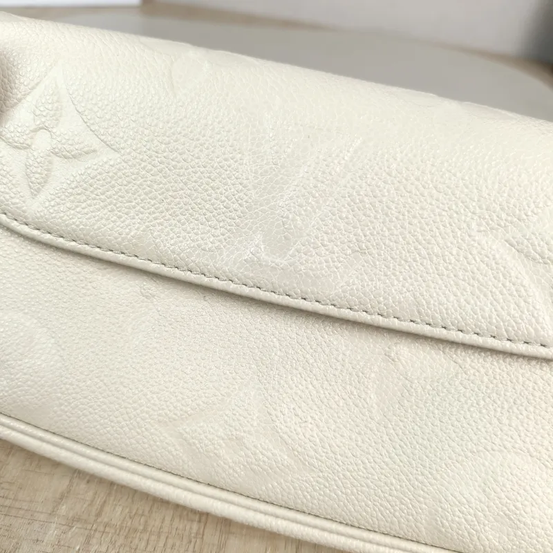 Louis Vuitton Crossbody Bag IVY White Monogram Empreinte Embossed Calfskin Small 23.5 × 4.3 × 12 cm — detail view 9 of 11