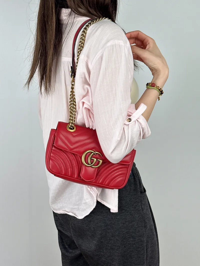 GUCCI Crossbody Bag GG Marmont Small Marmont 22Red Calfskin Small22 × 6 × 13 cm — on-model view 1 of 2