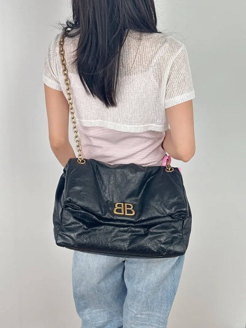 BALENCIAGA Shoulder Bag MONACO Chain Bag Black Calfskin Medium 34 × 15 × 24 cm — on-model view 1 of 3