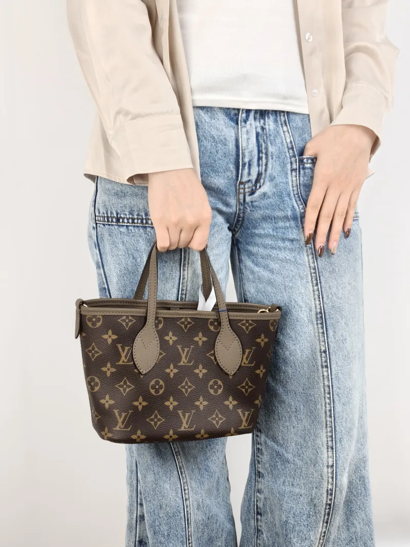 Louis Vuitton Crossbody Bag NEVERFULL INSIDE OUT BB PVC · Calfskin BB 26.5 × 11 × 16.5 cm — on-model view 1 of 2