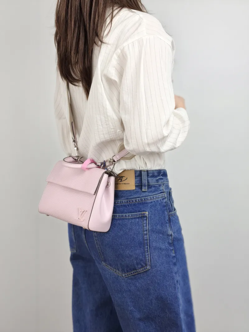 Louis Vuitton Crossbody Bag CLUNY Pink Epi Embossed Calfskin Mini 20 × 7.5 × 16 cm — on-model view 2 of 3
