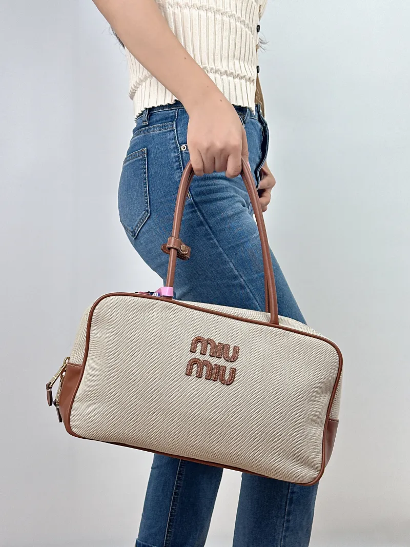 Miumiu Top Handle Bag Beau Brown Canvas · Calfskin Large34 × 10 × 20 cm — on-model view 2 of 2