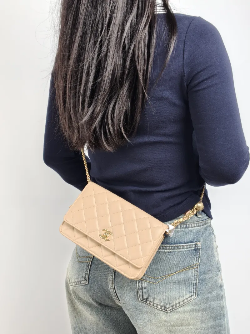 Chanel Crossbody Bag CF WOC Taupe Lambskin Mini 19.2 × 3.5 × 12.3 cm — on-model view 2 of 3
