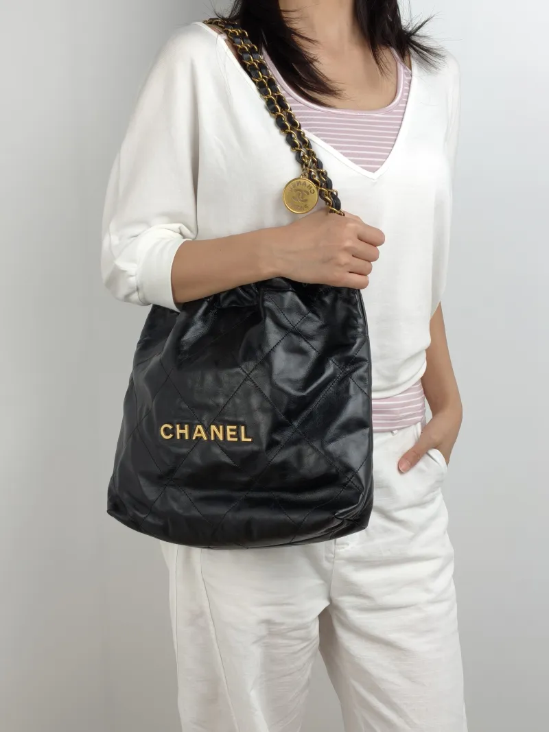 Chanel Shoulder Bag 22Bag Black CC alfskin Small 35 × 7 × 37 cm — on-model view 1 of 2