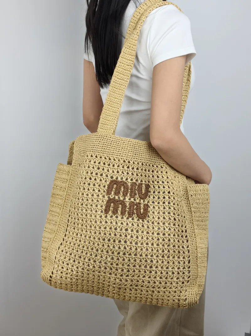 Miumiu Top Handle Bag Top Handle Bag Woven One Size 40 × 10 × 37 cm — on-model view 1 of 2