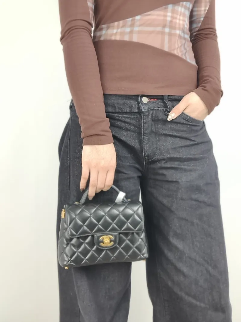 Chanel Crossbody Bag 25p Top Handle Crossbody Bag Black Lambskin Small 22 × 6 × 11.5 cm — on-model view 1 of 3