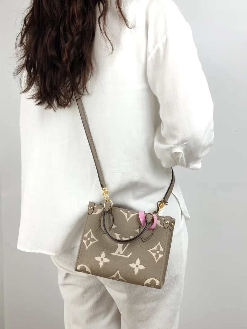 Louis Vuitton Crossbody Bag Onthego BB · White Empreinte Embossed Calfskin BB 18 × 8.5 × 15 cm — on-model view 1 of 2