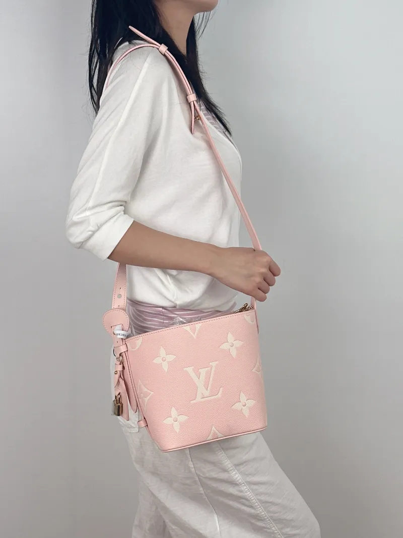 Louis Vuitton Top Handle Bag ALL IN BB · White Empreinte Embossed Calfskin BB16 × 12 × 18 cm — on-model view 1 of 3