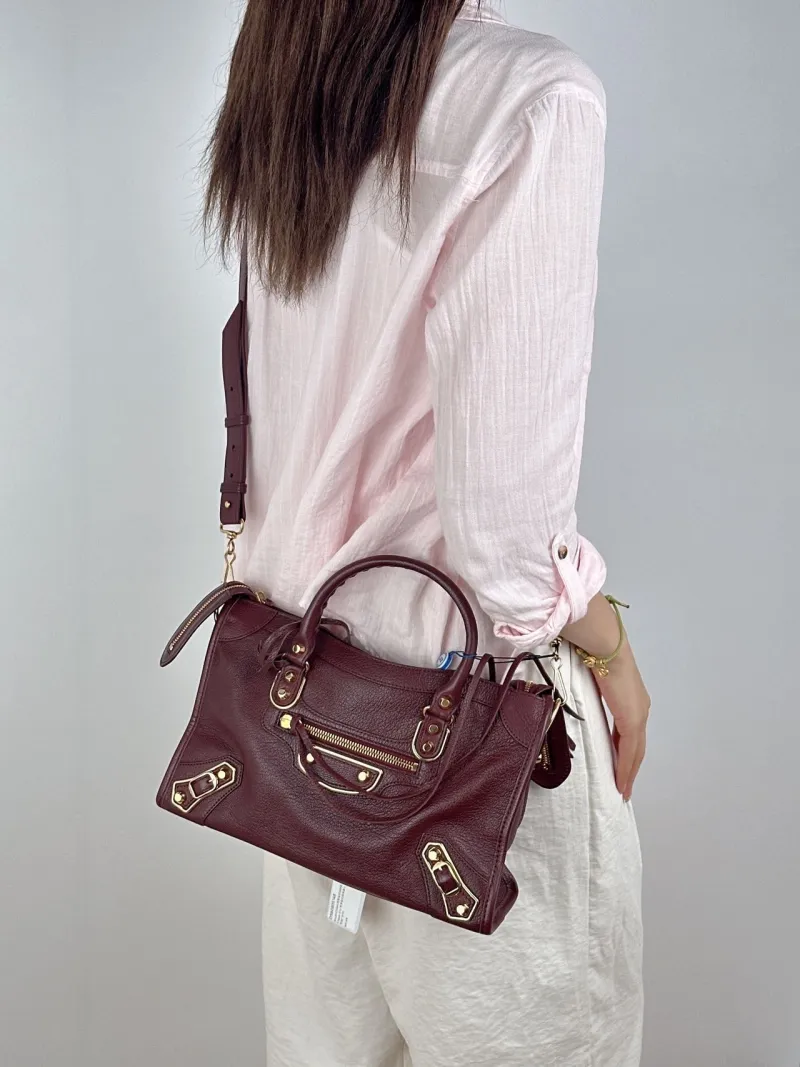 BALENCIAGA Crossbody Bag Classic City Red Lambskin Small30 × 10 × 21 cm — on-model view 2 of 3
