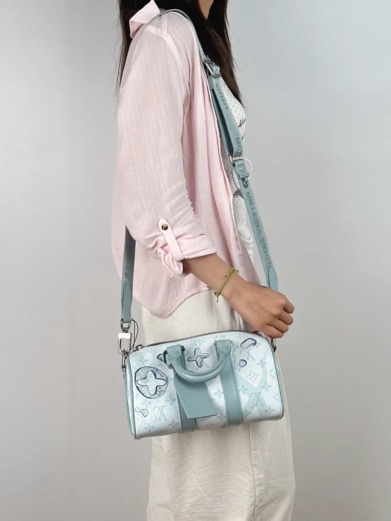 Louis Vuitton Crossbody Bag Keepall 25 Blue PVC Medium25 × 11 × 15 cm — on-model view 3 of 3