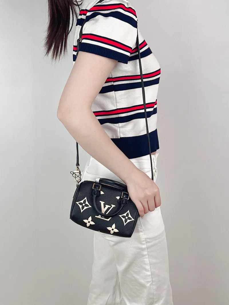 Louis Vuitton Crossbody Bag Speedy Nano Black · White Empreinte Embossed Calfskin Monogramnano16 × 7.5 × 10 cm — on-model view 2 of 3