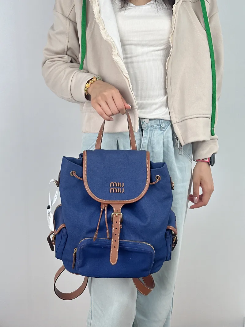 Miumiu Backpack Backpack Blue Canvas Large 25 × 12.5 × 29.5 cm — on-model view 2 of 3