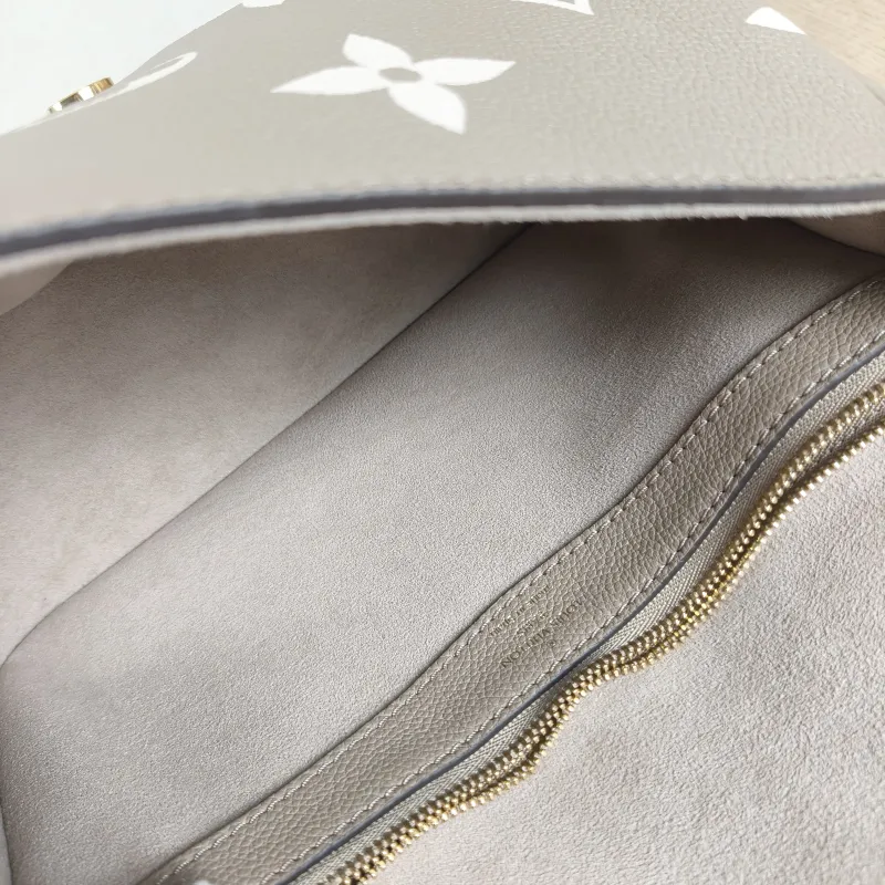Louis Vuitton Crossbody Bag Diane Baguette Bag Monogram Empreinte Embossed Calfskin Small 24 × 9 × 15 cm — detail view 8 of 13