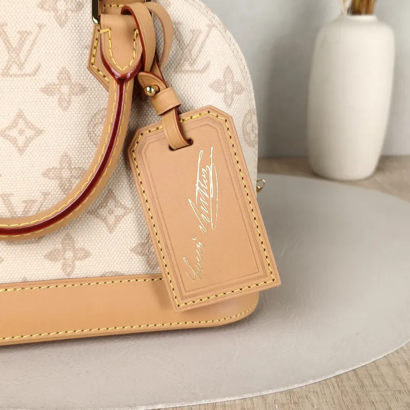Louis Vuitton Top Handle Bag Alma BB PVCBB23.5 × 11.5 × 17.5 cm — detail view 9 of 12