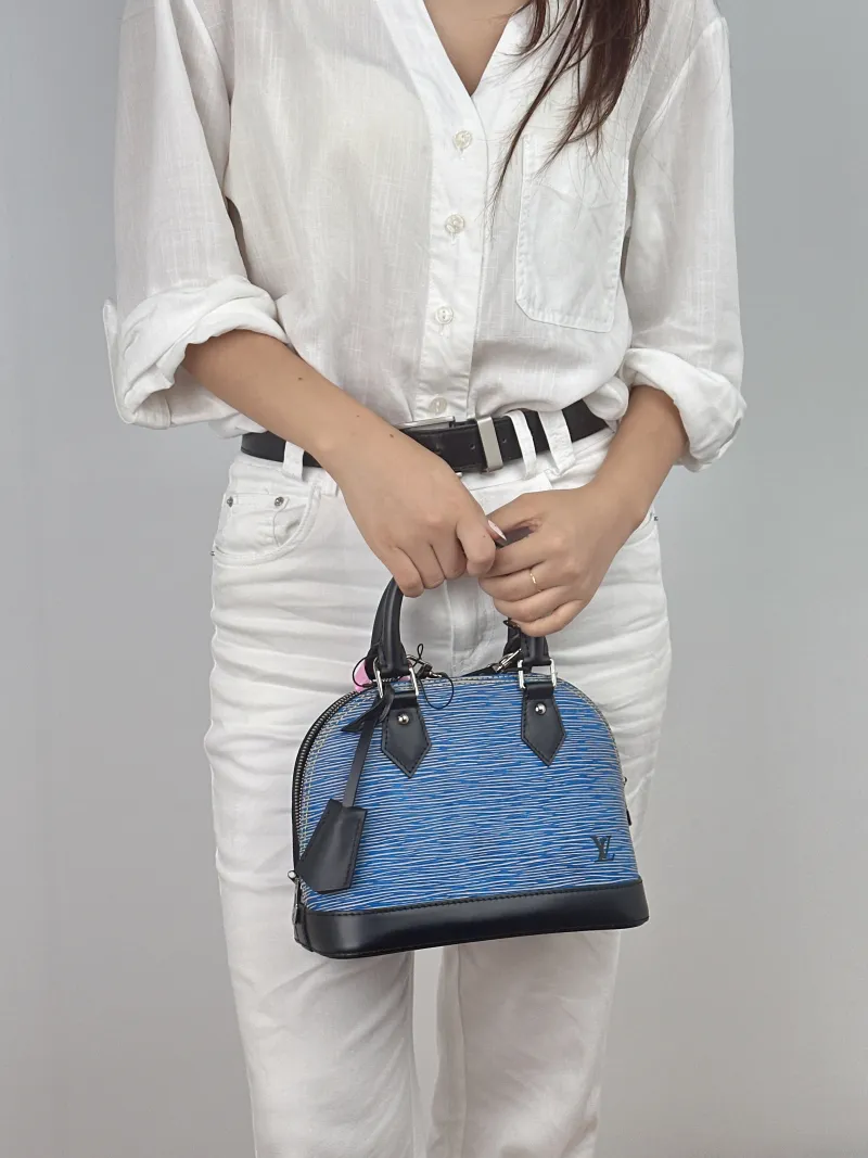 Louis Vuitton Top Handle Bag Alma BB Blue Epi Embossed Calfskin BB 23.5 × 11.5 × 17.5 cm — on-model view 1 of 2