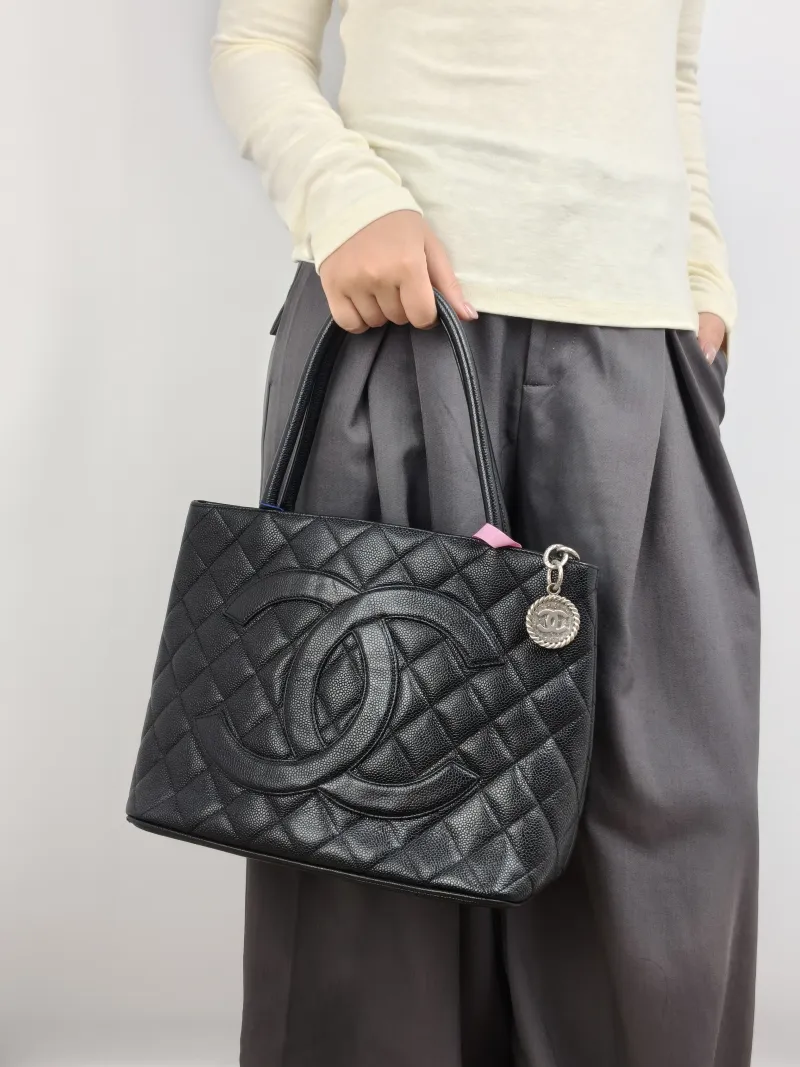 Chanel Top Handle Bag Medallion Black Grained Calfskin Large 30 × 15 × 24 cm 6 — on-model view 1 of 2