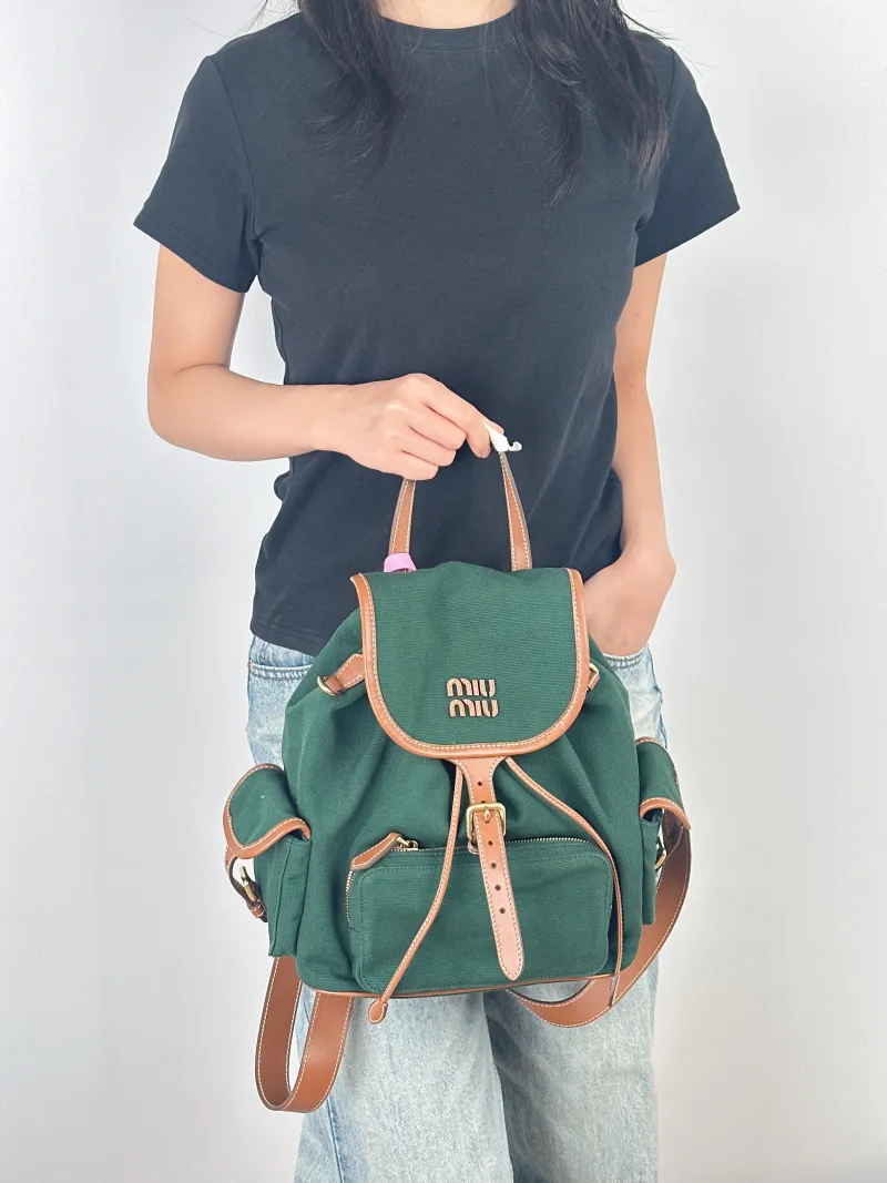 Miumiu Backpack Backpack Green Canvas Large25 × 12.5 × 29.5 cm — on-model view 1 of 3