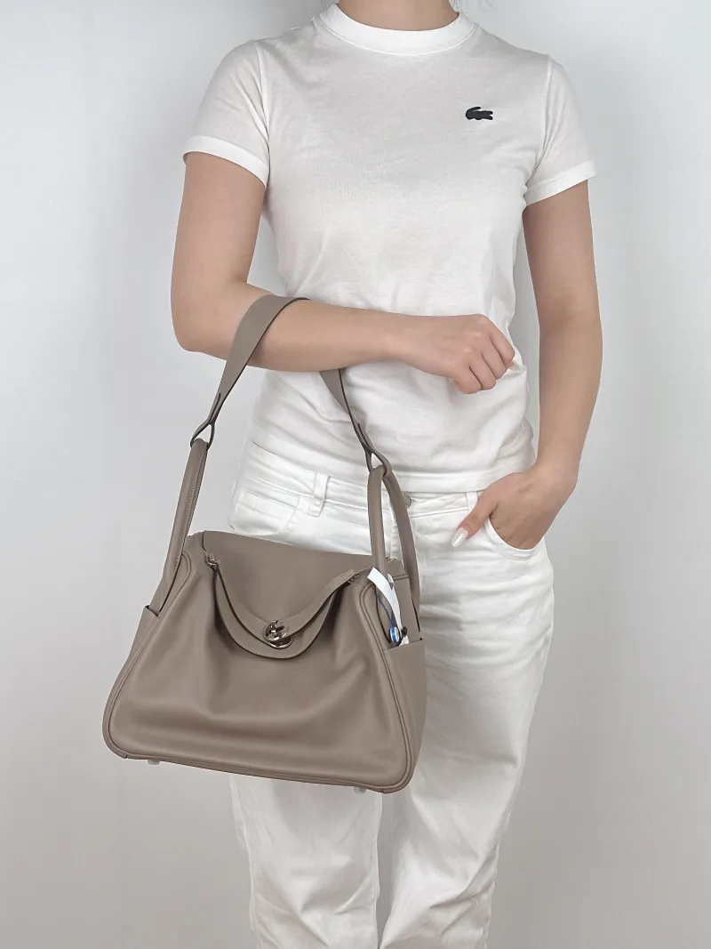 Hermès Crossbody Bag Lindy 30 Grey Blue Swift Calfskin30 × 15 × 19 cm — on-model view 2 of 2