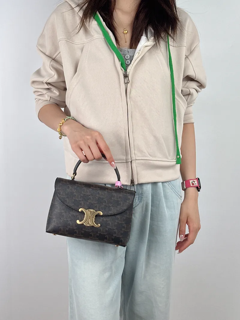 CELINE Top Handle Bag TEEN NINO Top Handle Bag Monogram PVC Small 20 × 8 × 13 cm — on-model view 2 of 2