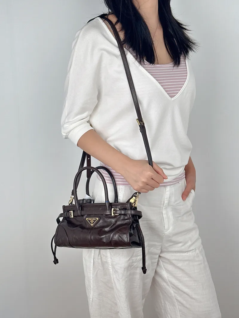 PRADA Top Handle Bag Bonnie Soft Lux Brown Waxed Leathermini23.5 × 9 × 12 cm — on-model view 3 of 3