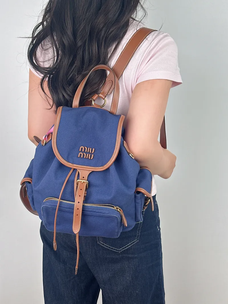 Miumiu Backpack Backpack Blue Canvas Large 25 × 12.5 × 29.5 cm — on-model view 1 of 2