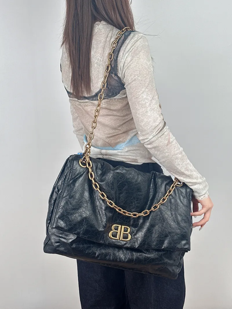 BALENCIAGA Shoulder Bag MONACO Chain Bag Black Calfskin Large43 × 15 × 33 cm — on-model view 1 of 2