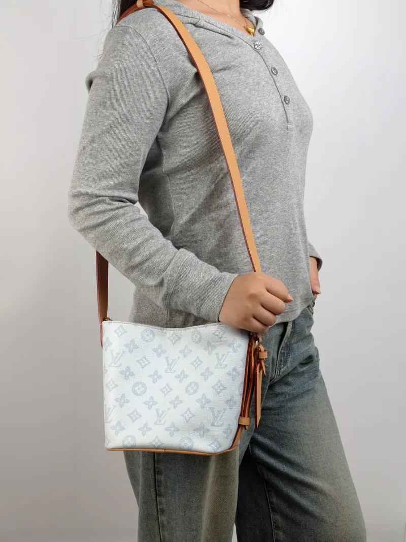 Louis Vuitton Top Handle Bag ALL IN BB Blue PVC BB 16 × 12 × 18 cm — on-model view 2 of 3
