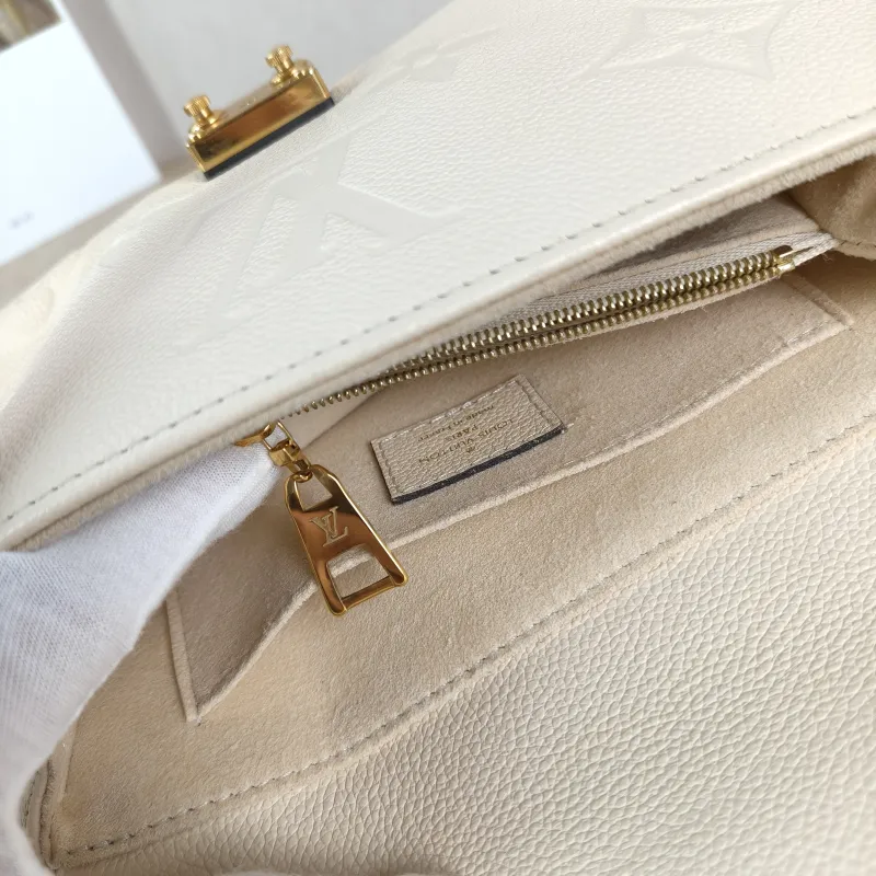 Louis Vuitton Crossbody Bag MADELEINE Beige Monogram Empreinte Embossed Calfskin BB 24 × 8.5 × 17 cm — detail view 8 of 12