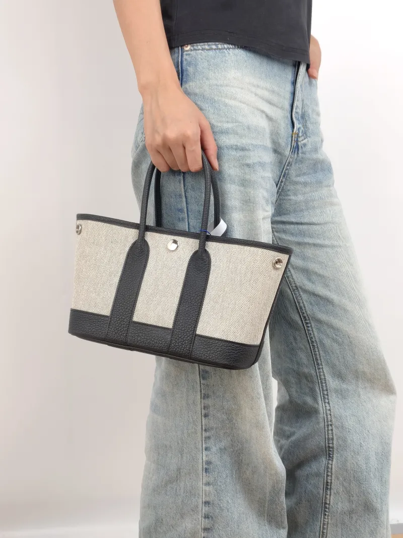 Hermès Top Handle Bag Neo Garden 23 Mini Black · Beige Canvas · Negonda Calfskin Mini 23 × 10 × 16 cm k — on-model view 2 of 2