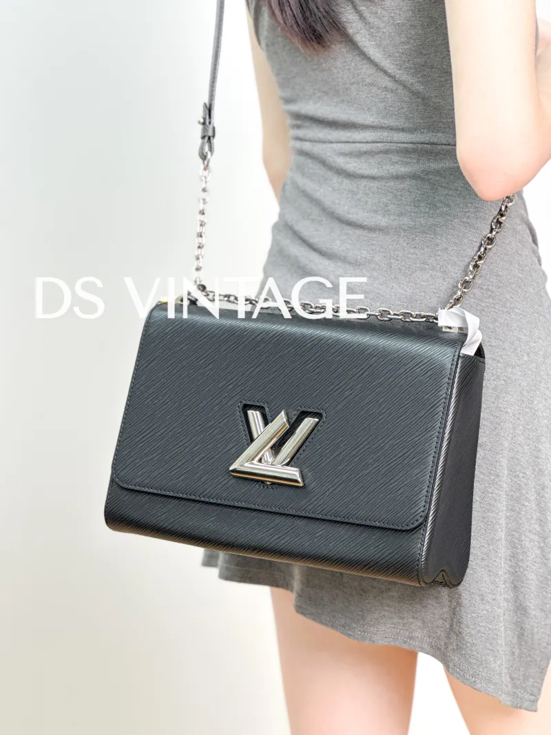 Louis Vuitton Crossbody Bag Twist Black Epi Embossed Calfskin Medium 23 × 9.5 × 17 cm — on-model view 2 of 3