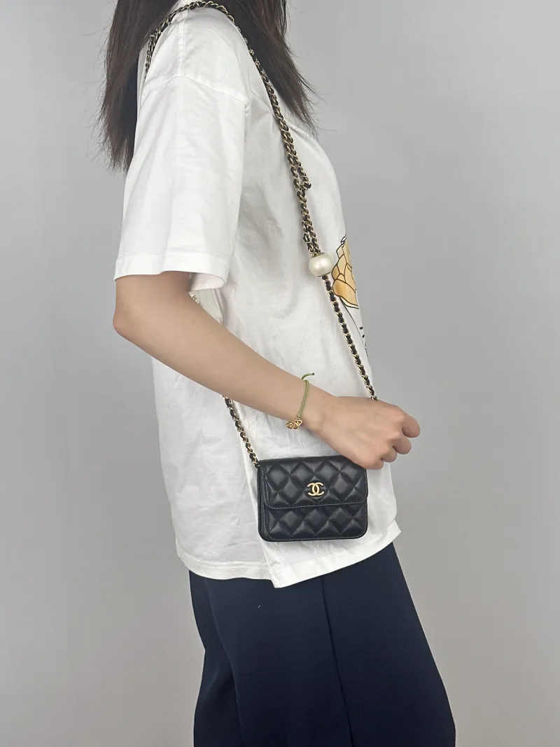 Chanel Crossbody Bag Crossbody Bag Black with Gold-Tone Hardware Lambskinmini12 × 2.5 × 9.5 cm — on-model view 1 of 2