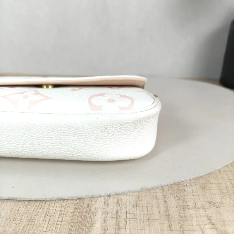 Louis Vuitton Crossbody Bag IVY White · Pink Empreinte Embossed Calfskin Small 23.5 × 4.3 × 12 cm — detail view 11 of 12
