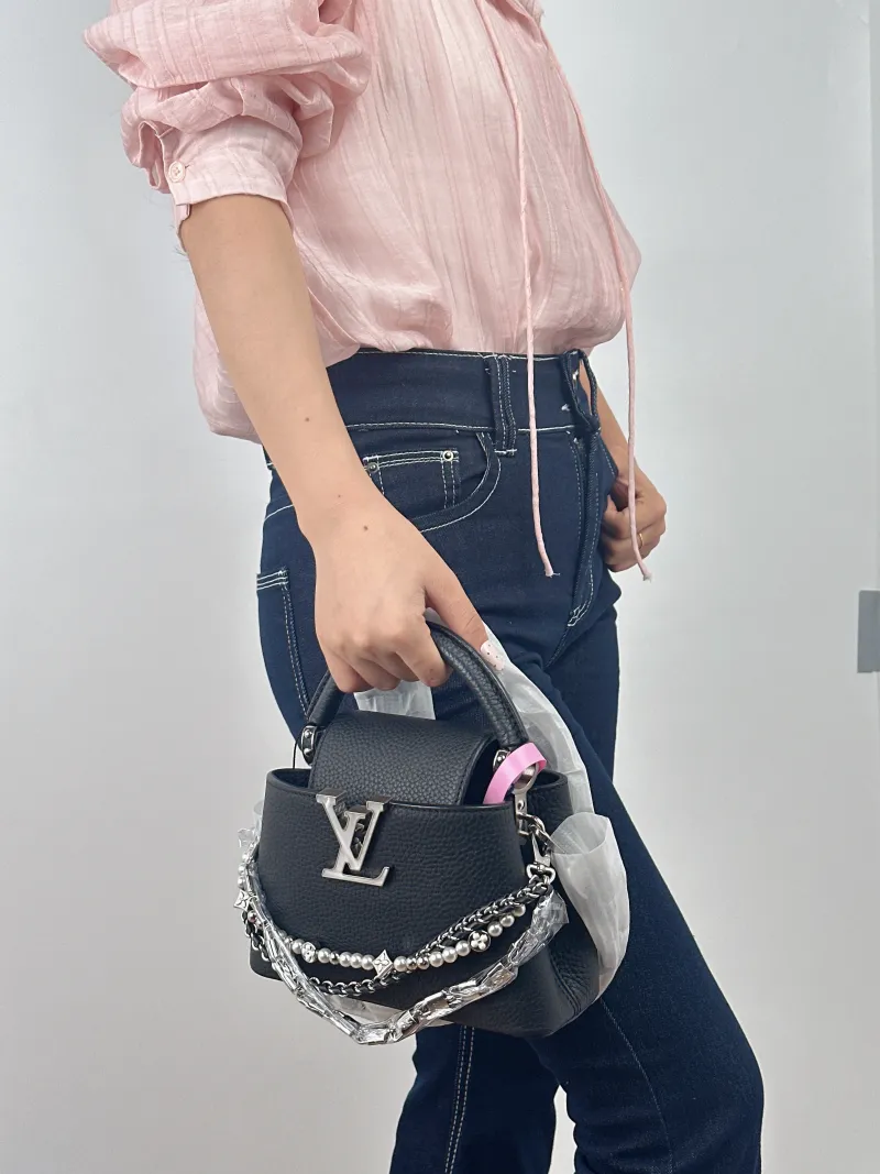 Louis Vuitton Shoulder Bag Capucines Black Calfskin Mini 21 × 8 × 14 cm — on-model view 1 of 2