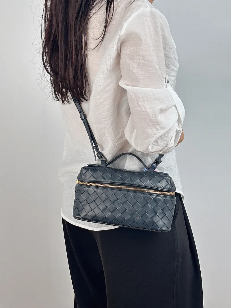 Bottega Veneta Top Handle Bag Woven Top Handle Bag Black Calfskin One Size 23 × 5.5 × 13 cm — on-model view 1 of 2