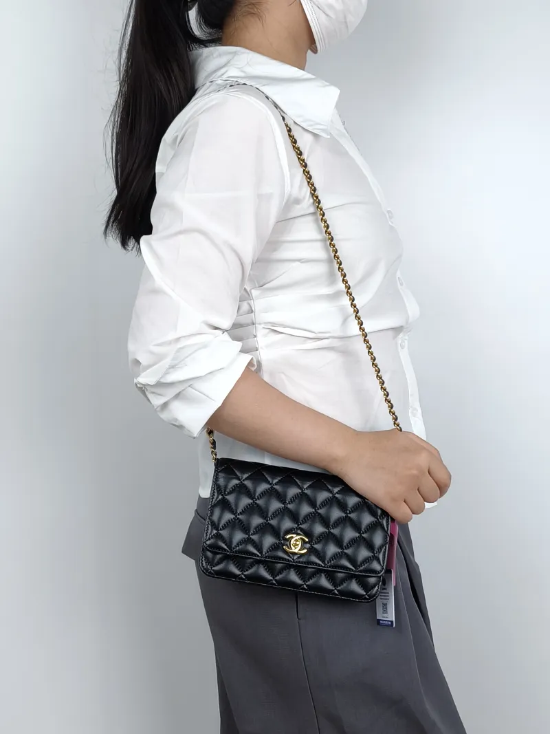 Chanel Crossbody Bagcf woc Black Calfskinmini19.2 × 3.5 × 12.3 cm — on-model view 1 of 4