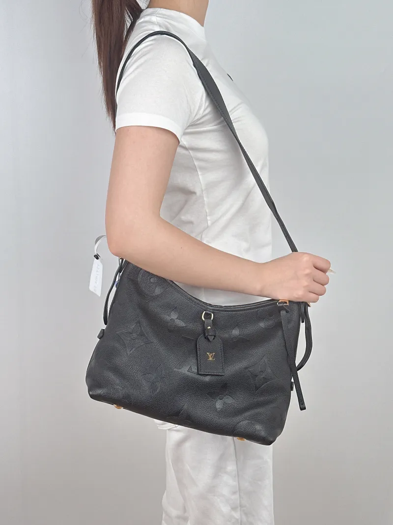 Louis Vuitton Crossbody Bag Carryall Black Calfskin Small29.5 × 12 × 24 cm — on-model view 1 of 2