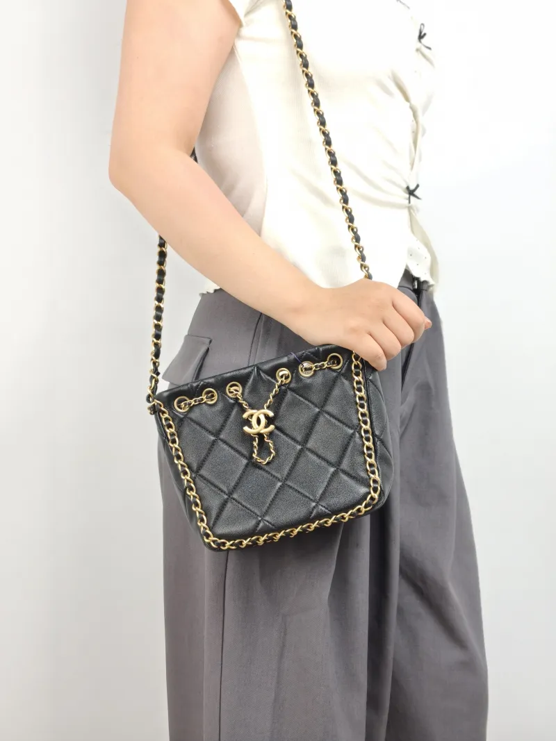 Chanel Shoulder Bag Bucket Bag Black Lambskin One Size 22 × 8 × 17 cm — on-model view 1 of 2