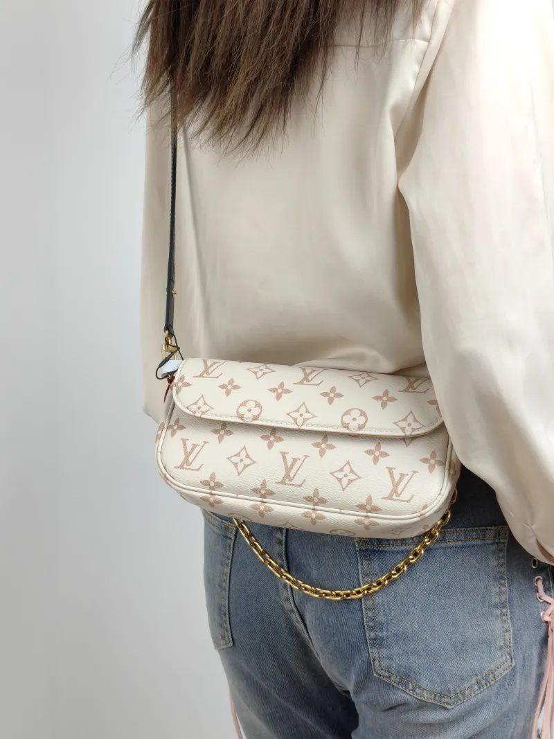 Louis Vuitton Crossbody Bag IVY · Beige PVC Small 23.5 × 4.3 × 12 cm — on-model view 1 of 3