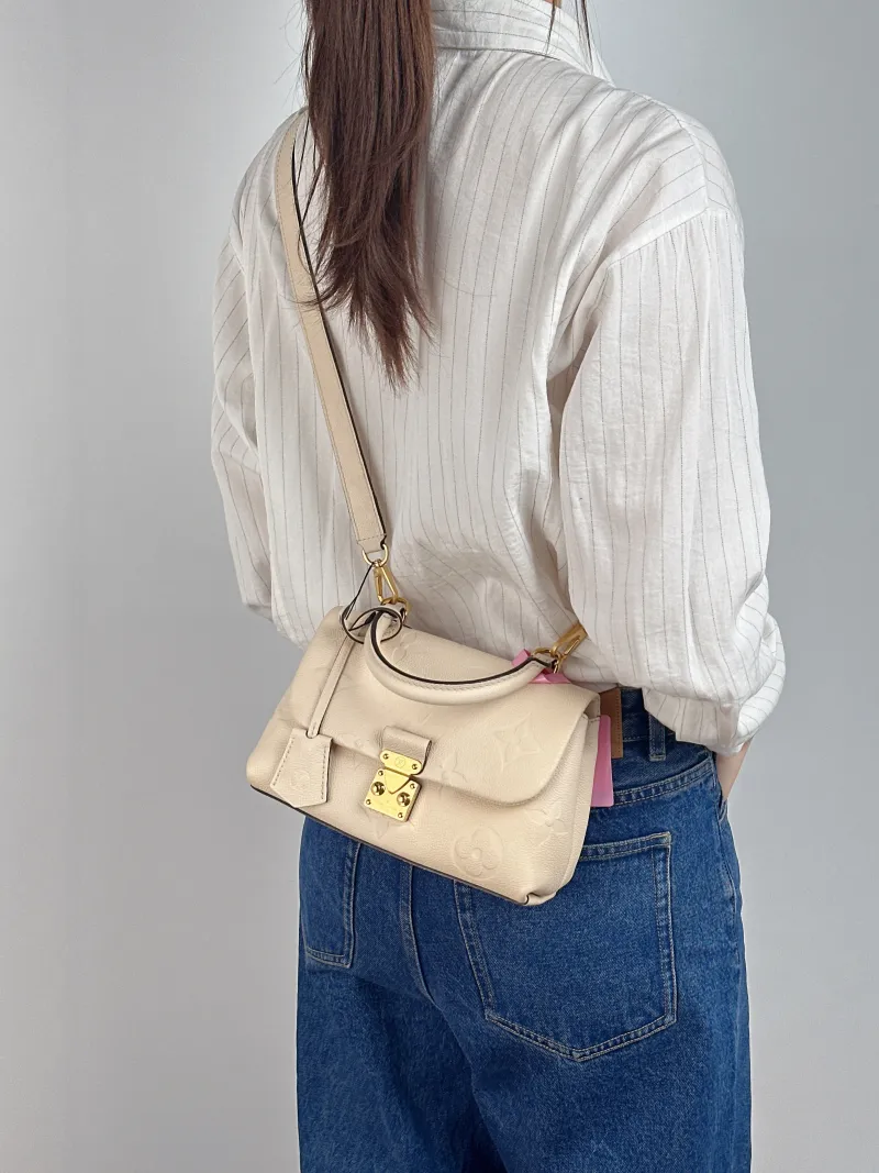 Louis Vuitton Crossbody Bag MADELEINE Beige Monogram Empreinte Embossed Calfskin BB 24 × 8.5 × 17 cm — on-model view 2 of 3