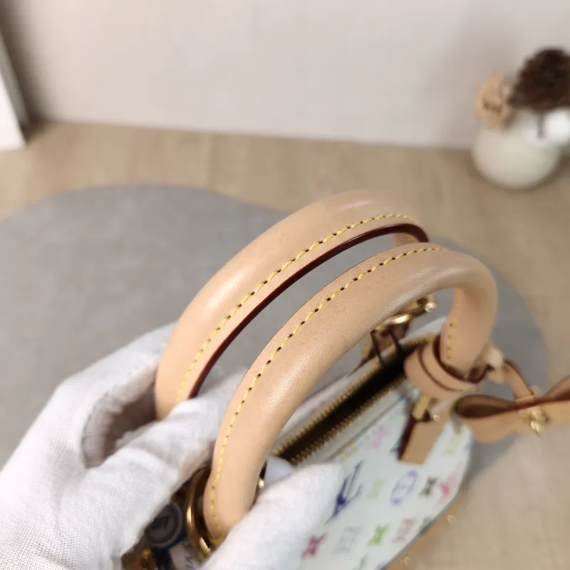 Louis Vuitton Crossbody Bag Alma BB Multicolore PVCBB23.5 × 11.5 × 17.5 cm — detail view 4 of 13