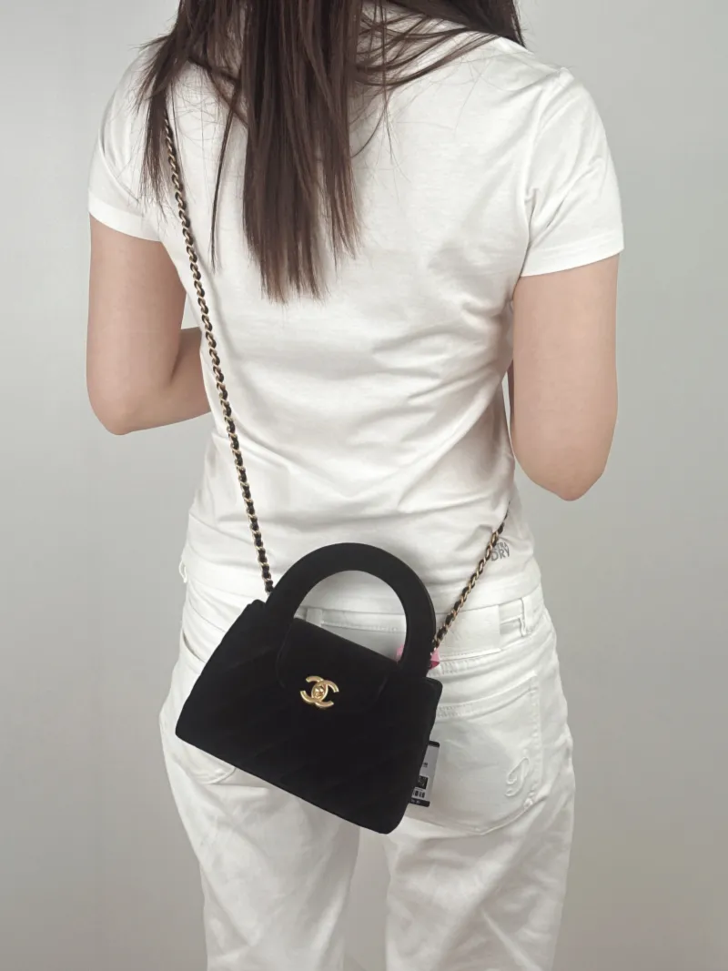 Chanel Crossbody Bag Kelly Black Velvetmini19 × 7 × 13 cm — on-model view 2 of 3