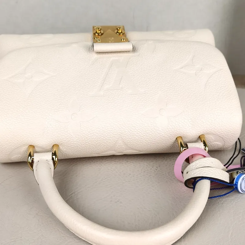 Louis Vuitton Crossbody Bag MADELEINE White Monogram Empreinte Embossed Calfskin BB 24 × 8.5 × 17 cm — detail view 12 of 14