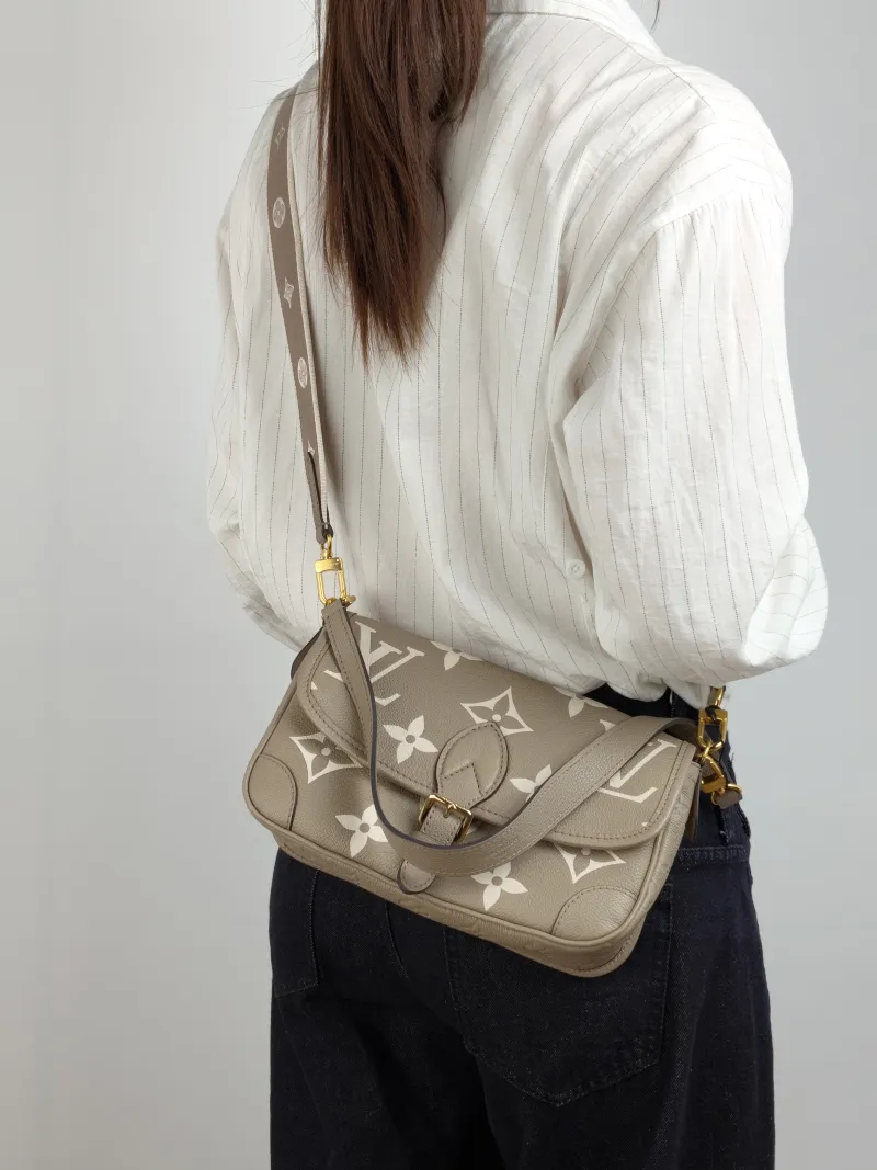 Louis Vuitton Crossbody Bag Diane Baguette Bag Monogram Empreinte Embossed Calfskin Small 24 × 9 × 15 cm — on-model view 2 of 2