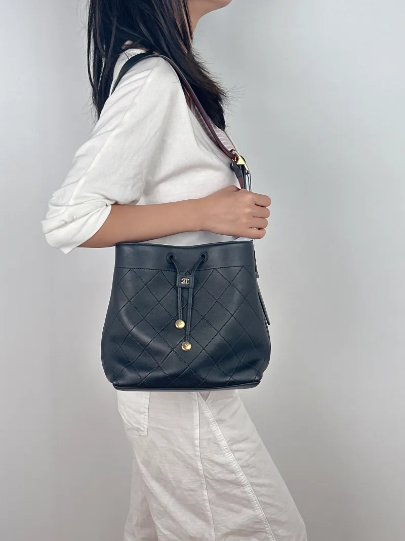Chanel Shoulder Bag Bucket Bag Black Lambskin One Size 23 × 13 × 23 cm — on-model view 2 of 2