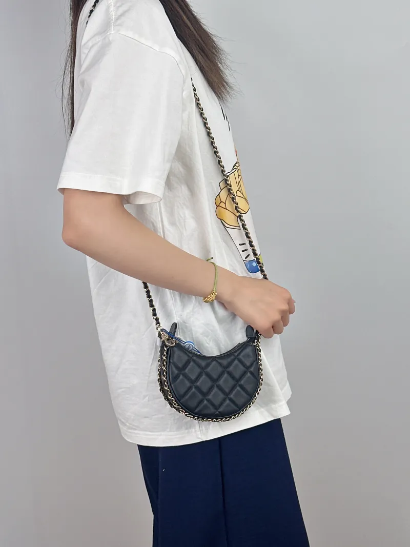 Chanel Crossbody Bag 23p Black Lambskin Mini 13.5 × 5 × 9.5 cm — on-model view 2 of 2
